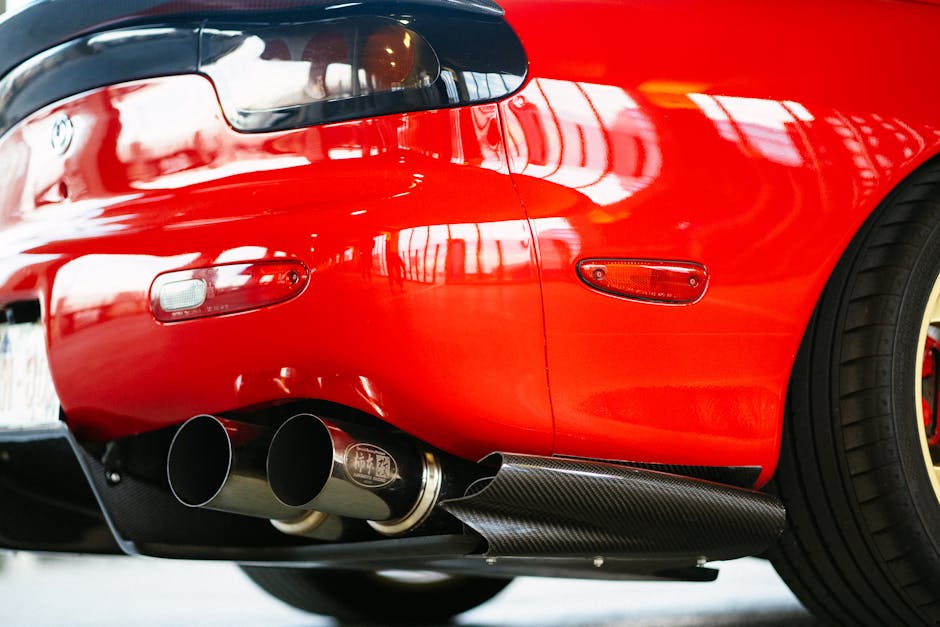 Close up of red car exhaust